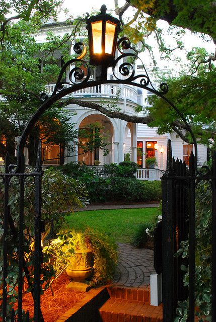 Wrought iron gate opening to a stately Ottawa home